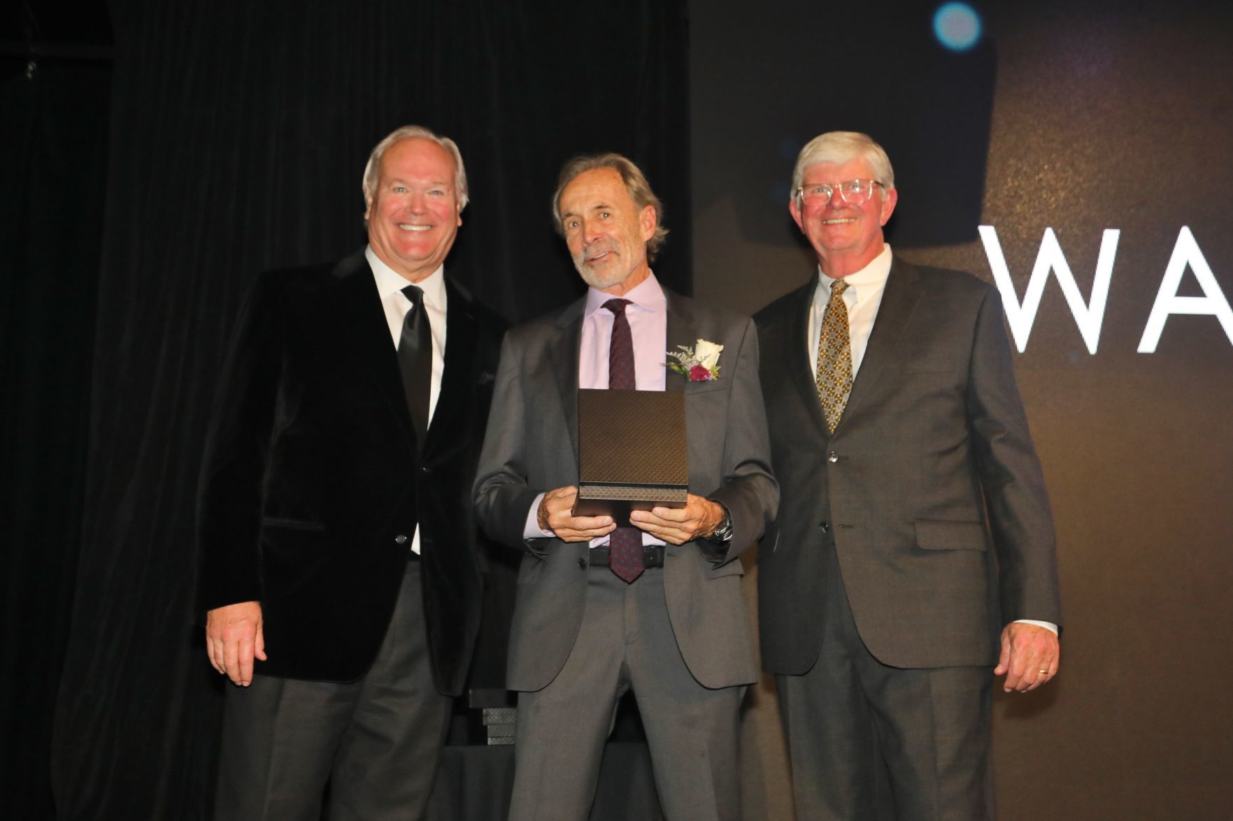 Dick Miles, Chairman of the Board, Walter Iooss, honoree, Bob Bishop, chair of induction committee and board member